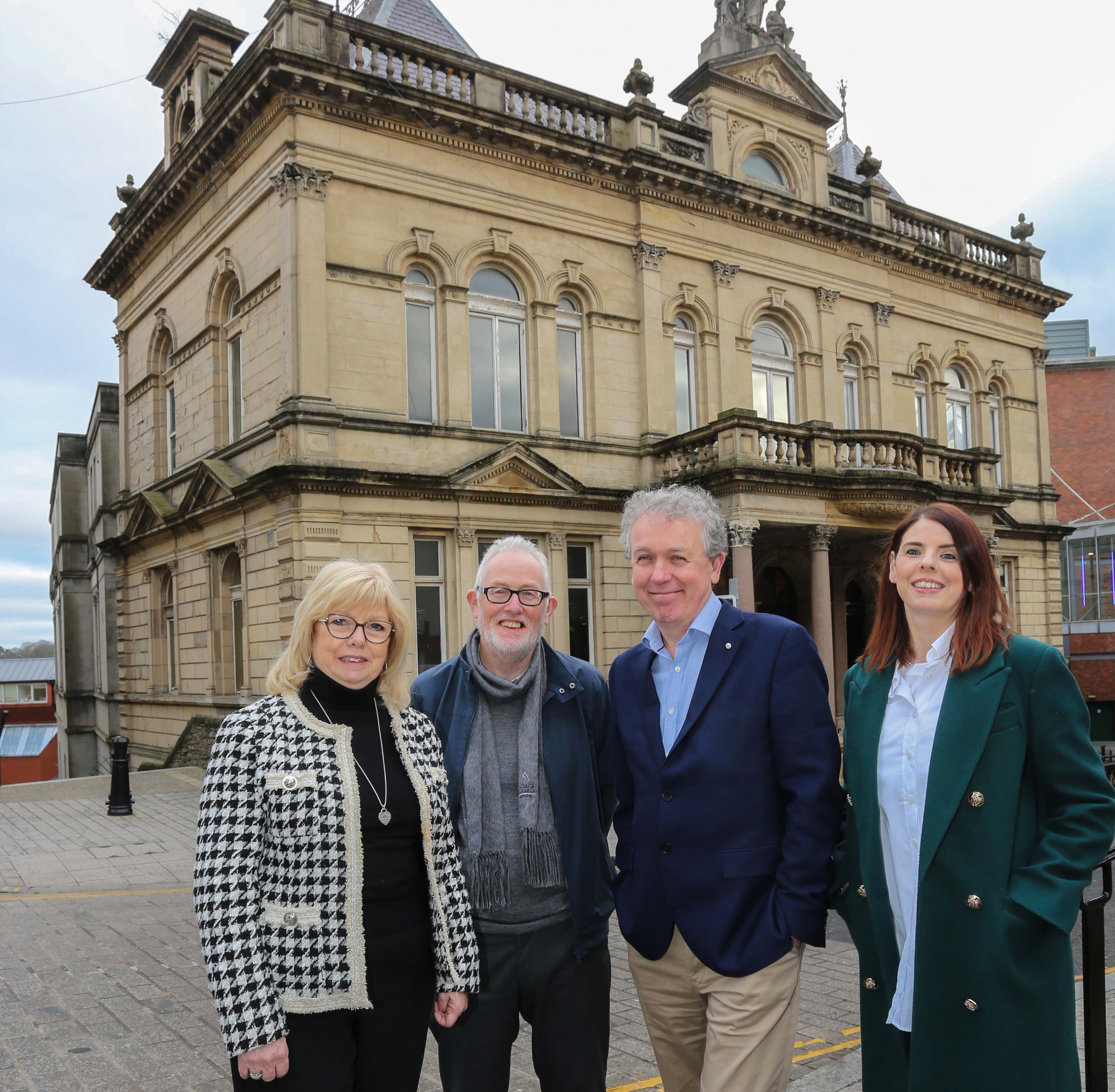 Outside Image of St Columb's Hall Featuring Staff, Trustees and the Funder, Paul Mullan of National Lottery Heritage Fund